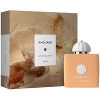 Amouage Love Delight perfume bottle on and box on a white background
