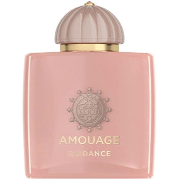 Amouage Guidance perfume bottle in a soft pink color with a metallic gold band and a ribbed champagne-colored cap, shown on a plain white background.